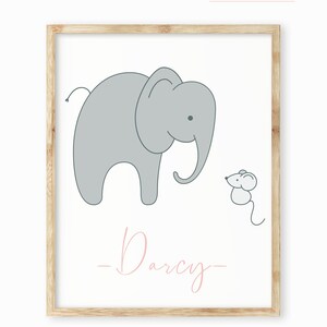 May include: A framed print with a light gray elephant and a small gray mouse. The text "Baba Snug" is in pink at the top of the print and the name "Darcy" is in pink at the bottom.