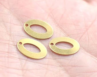 May include: Three gold oval-shaped metal charms with a hole at the top for attaching to jewelry or other crafts.
