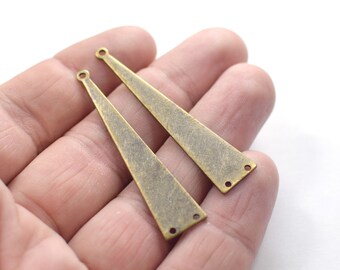 May include: Two antique gold-toned metal triangle-shaped pendant charms with holes for attaching jump rings.