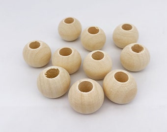 Lot of wooden beads of different diameters, for DIY, creative hobbies and macrame