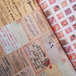 May include: A close-up of a fabric with a vintage aesthetic. The fabric features a repeating pattern of postage stamps in various shades of red and brown. The stamps are arranged in a grid pattern on a white background. The fabric is folded over, revealing a second layer with a different pattern of vintage text and graphics.