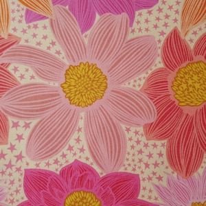 May include: A floral pattern featuring large, stylized flowers in shades of pink, red, and orange with yellow centers. The background is a cream color with small pink stars scattered throughout. The design is bold and colorful.