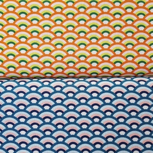 May include: Two fabric swatches with a repeating pattern of overlapping half circles. The top swatch is orange with green, white, and yellow half circles. The bottom swatch is blue with pink, white, and light blue half circles.