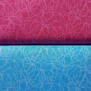 May include: Two fabric swatches with a white scribble pattern on a pink and blue background.