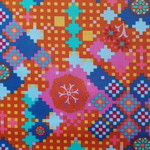 May include: A colorful fabric with a geometric pattern in shades of orange, pink, blue, and green. The pattern features squares, circles, and other shapes.