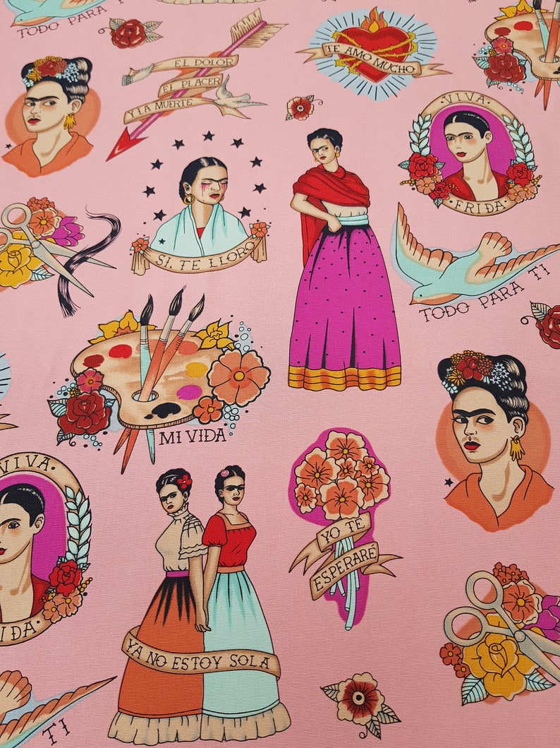 May include: Pink fabric featuring illustrations of Frida Kahlo, roses, paintbrushes, and text in Spanish. The design includes tattoo-style elements like banners and hearts, creating a vibrant and artistic pattern.