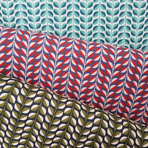 May include: Three fabric swatches with a repeating pattern of stylised leaves. The top swatch is teal and white, the middle swatch is red, white, and navy blue, and the bottom swatch is green, white, and navy blue.