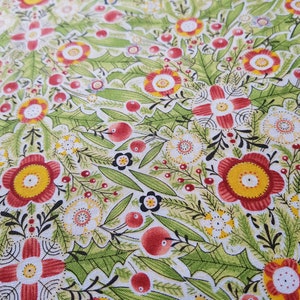 May include: A green, white, and red floral fabric with a repeating pattern of stylized flowers and berries. The fabric has a textured surface.