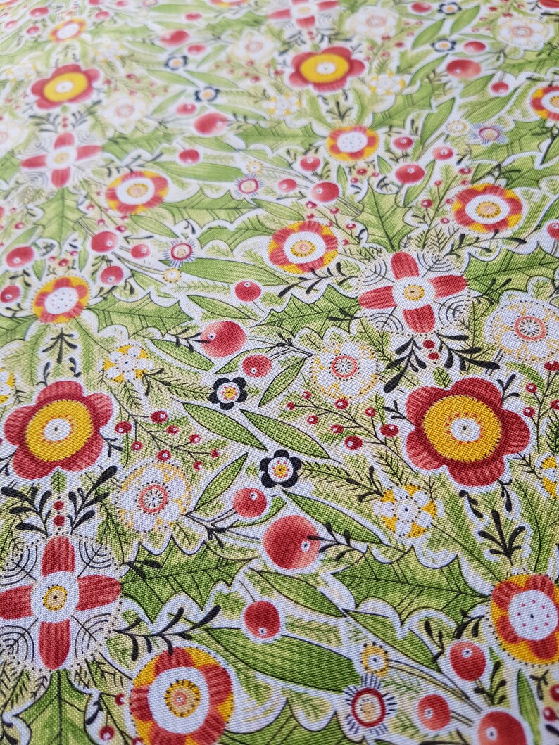 May include: A green, white, and red floral fabric with a repeating pattern of stylized flowers and berries. The fabric has a textured surface.