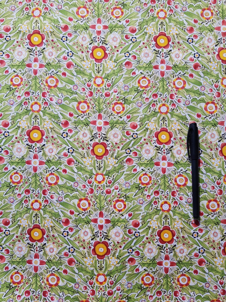 May include: A green fabric with a repeating pattern of red, yellow, and white flowers. The fabric has a white background and is covered in a dense floral pattern.