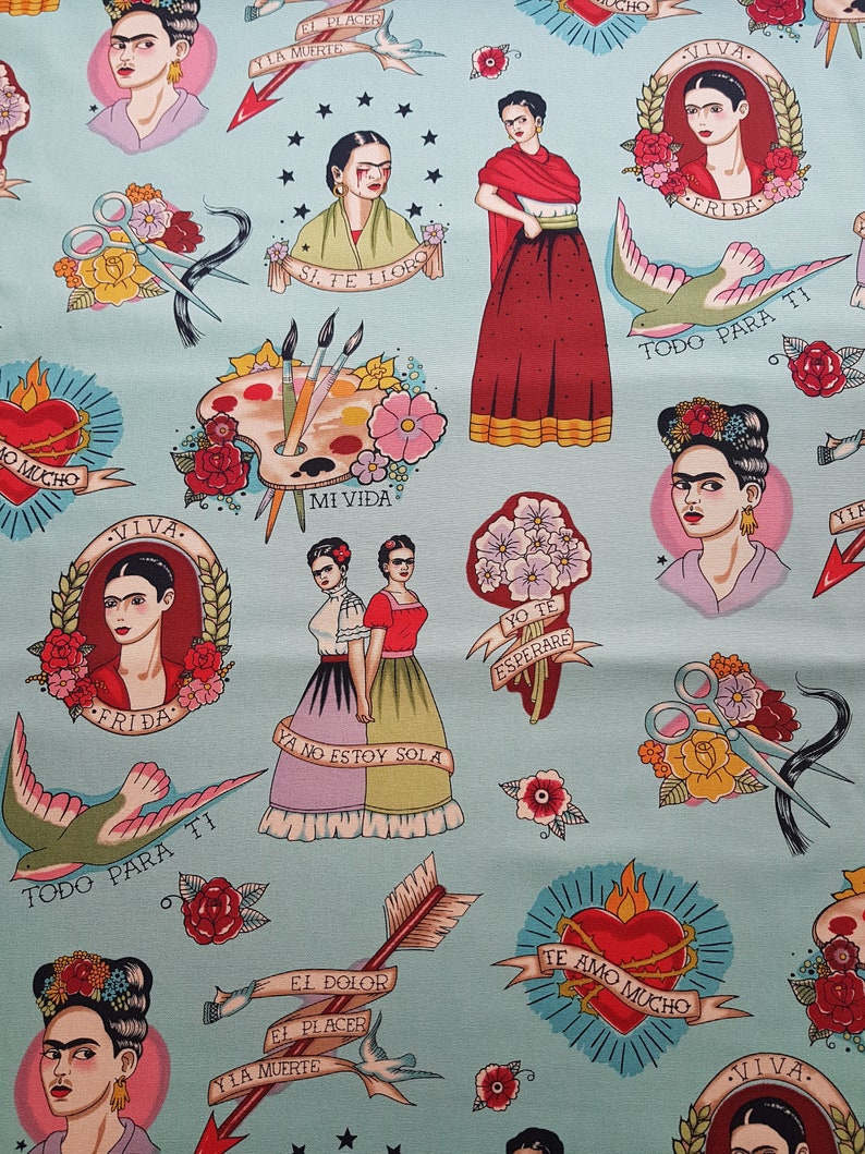 May include: Light blue fabric featuring Frida Kahlo illustrations in a tattoo style. The design includes portraits, hearts, flowers, swallows, arrows, and text in Spanish. The overall aesthetic is a blend of art and cultural motifs.