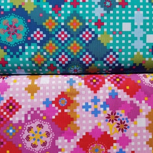 May include: Two pieces of fabric with a pixelated geometric pattern. The top fabric is teal, blue, and green with red, orange, and yellow accents. The bottom fabric is pink with red, orange, yellow, and brown accents.