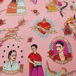 May include: Pink fabric featuring Frida Kahlo-inspired illustrations in a tattoo style. The design includes portraits, hearts, arrows, flowers, and text in Spanish. The color palette includes pink, red, blue, and black.