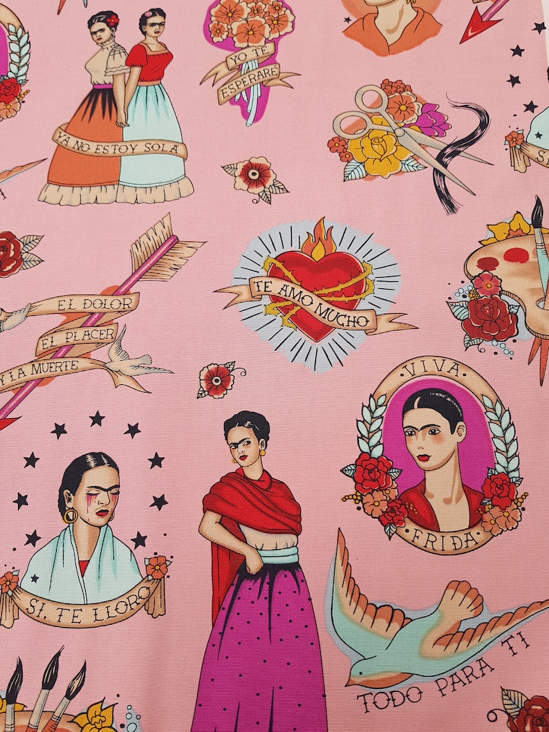 May include: Pink fabric featuring Frida Kahlo-inspired illustrations in a tattoo style. The design includes portraits, hearts, arrows, flowers, and text in Spanish. The color palette includes pink, red, blue, and black.