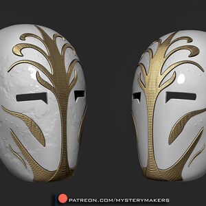 Op de afbeelding: Een wit masker met gouden details. Het masker heeft een gestileerd boomontwerp en twee ooggaten. Het masker is gemaakt van een glad, getextureerd materiaal.
