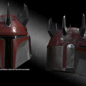 Pode incluir: Um capacete mandaloriano vermelho e preto com um design único que apresenta espinhos no topo. O capacete tem um aspecto desgastado e desbotado.