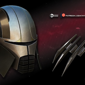 Könnte beinhalten: Ein silberner und schwarzer Helm mit goldener Verzierung. Der Helm hat ein Visier und eine Reihe schwarzer Paneele an der Vorderseite. Der Helm wird von einem Satz von drei silbernen Krallen begleitet.