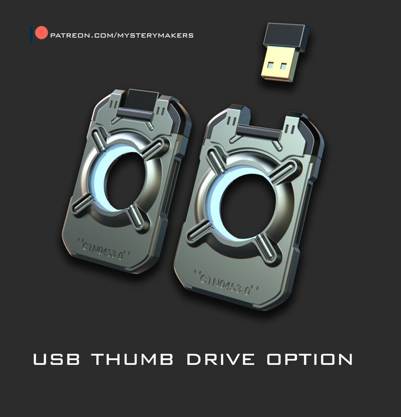 May include: Two silver USB thumb drives with a circular design and the text "GTNO453.0" on each. The thumb drives are on a black background.