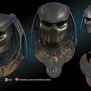 May include: A detailed metallic Predator mask and necklace. The mask has a dark, textured surface with a unique design. The necklace features an Egyptian-style pendant with red, blue, and gold detailing. The overall design is intricate.