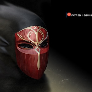 May include: A red wooden mask with gold accents and intricate designs. The mask has eye holes and a long, pointed nose.