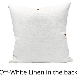 May include: Off-white linen pillow cover with a subtle texture. The back of the pillow cover is visible.