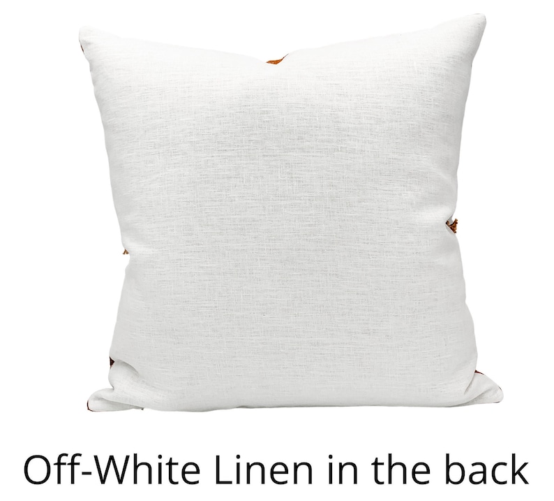 May include: Off-white linen pillow cover with a subtle texture. The back of the pillow cover is visible.