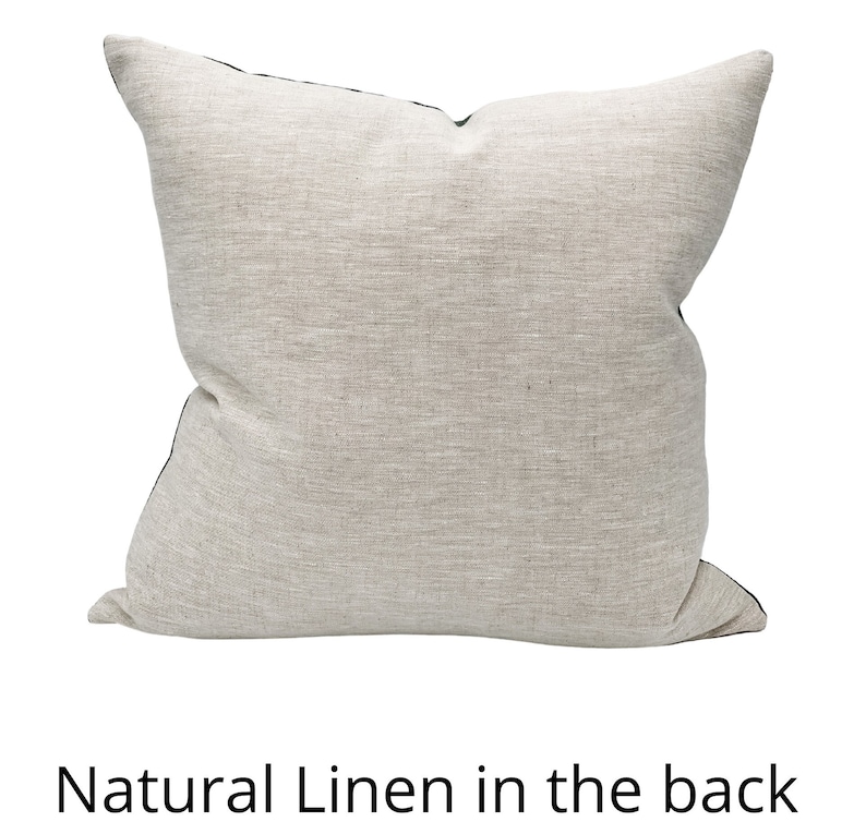 May include: A natural linen pillow with a black trim. The back of the pillow is made of natural linen.