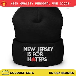 May include: Black beanie with the text "NEW JERSEY IS FOR HATERS" embroidered in white, with a red heart replacing the word "heart". The hat is a unisex beanie.