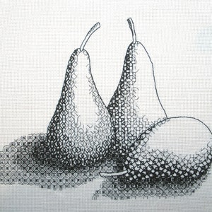 May include: Two black and white pears, stitched in a cross-stitch pattern, are displayed on a white background.