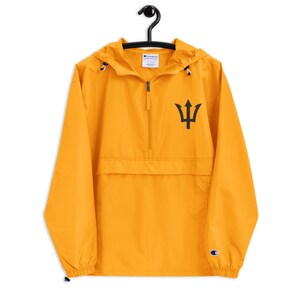 May include: A yellow Champion brand windbreaker with a black trident logo on the front. The jacket has a zip closure and a hood.