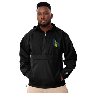May include: A black windbreaker jacket with a zipper closure and a small embroidered image of the Barbados flag on the left chest. The jacket has a drawstring hood and a Champion logo on the left sleeve.