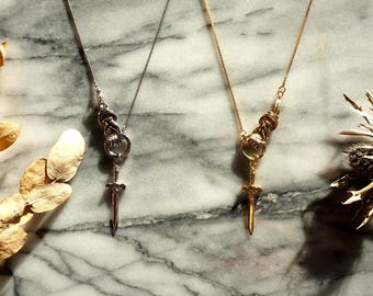 THE HAND Gold / Silver / Black hand and sword necklace / Gold / Silver / Black sword statement necklace