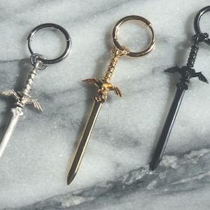 LEYENDA Pendiente de aro con espada de oro, plata y bronce INDIVIDUAL / Pendiente con espada maestra de Zelda