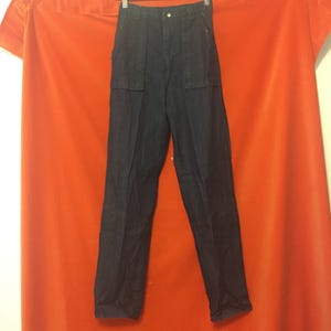May include: A pair of dark blue denim pants with a straight leg and two large pockets on each side.