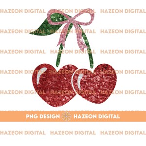 Op de afbeelding: Twee rode kersen met hartvormige toppen, bedekt met glinsterende pailletten, met een groene steel en een roze strik.