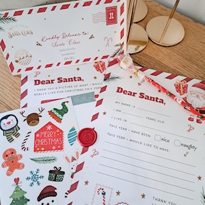 May include: A Christmas-themed stationery set featuring a letter to Santa, an envelope, and decorative stickers. The envelope reads "Kindly Deliver to: Santa Claus." The letter includes fill-in-the-blank sections and a space for a drawing. The stickers feature festive images.