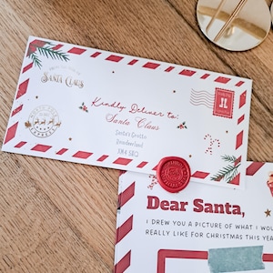 May include: A festive letter addressed to Santa Claus, featuring a red wax seal and a decorative border. The envelope includes a North Pole Express stamp and the text "Kindly Deliver to: Santa Claus". A matching letter is visible below.