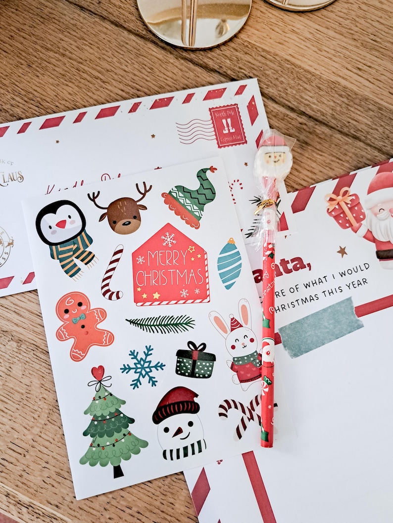 May include: Christmas-themed stationery set with stickers, a pencil, and envelopes. The stickers feature festive characters like a penguin, reindeer, and snowman, along with candy canes and a Christmas tree. The pencil has a Santa topper.