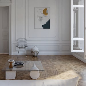 May include: A white room with a glass coffee table, a metal chair, and a vase. A framed print with a line drawing of a face and abstract shapes in yellow, blue, and gray hangs on the wall. The text on the print reads "Don't let the fear win."