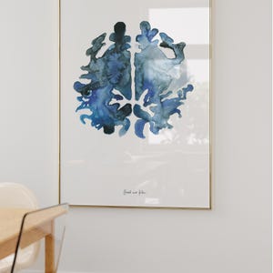 May include: A framed watercolor painting of a blue brain with the text "Each one flows" in cursive.