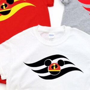 May include: Three short-sleeved t-shirts in red, white, and grey, each with a stylized graphic design. The design incorporates a Mickey Mouse head within a wave-like pattern. White trainers and denim shorts are also visible.