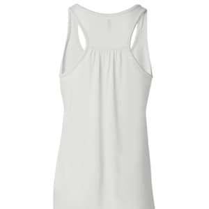 May include: White sleeveless tank top with a scoop neck and racerback style.