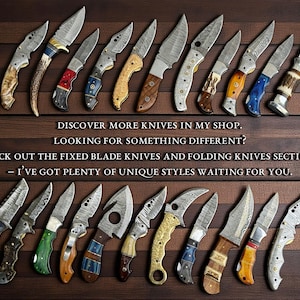May include: An assortment of knives with various handle designs and blade styles, arranged on a wooden surface. The blades have unique patterns. Text on the image reads: Discover more knives in my shop. Check out the fixed blade knives and folding knives sections.