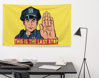 May include: A yellow flag with a cartoon illustration of a police officer with his hand raised in a stop gesture. The text "THIS IS THE LAST STOP" is printed in red on a white background at the bottom of the flag.