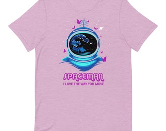 May include: A pink t-shirt with a graphic of an astronaut's helmet with a blue wave and a starry sky inside. The text "Spaceman" is in pink letters with a purple outline and the text "I love the way you move" is in smaller pink letters below.