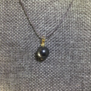 Necklace, Tahitian cultured pearl pendant, 20 inch black hemp cord with highly polished lobster clasp and end tab