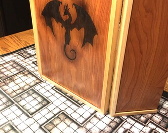 May include: A wooden three-panel screen with a black dragon design burned into the center panel. The screen is sitting on a white and gray tiled surface.