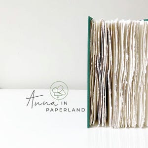 Non un comune diario d'arte: un grazioso libro con copertina rigida in lino, riempito con pagine di carta di cotone.