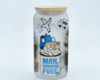 May include: White glass jar with a bamboo lid and a colorful design featuring a bird, a truck, a mailbox, and a cup of coffee with the text "Mail Carrier Fuel".