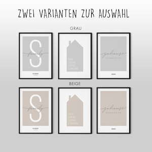 Pu&ograve; includere: Due stampe incorniciate con sfondi di colore diversi, grigio e beige. Ogni stampa presenta tre diversi design: una casa con nomi, una lettera S con la parola "family" e la parola "zuhause" con coordinate.